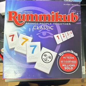 NEW! Rummikub game in original box with original tape to seal.